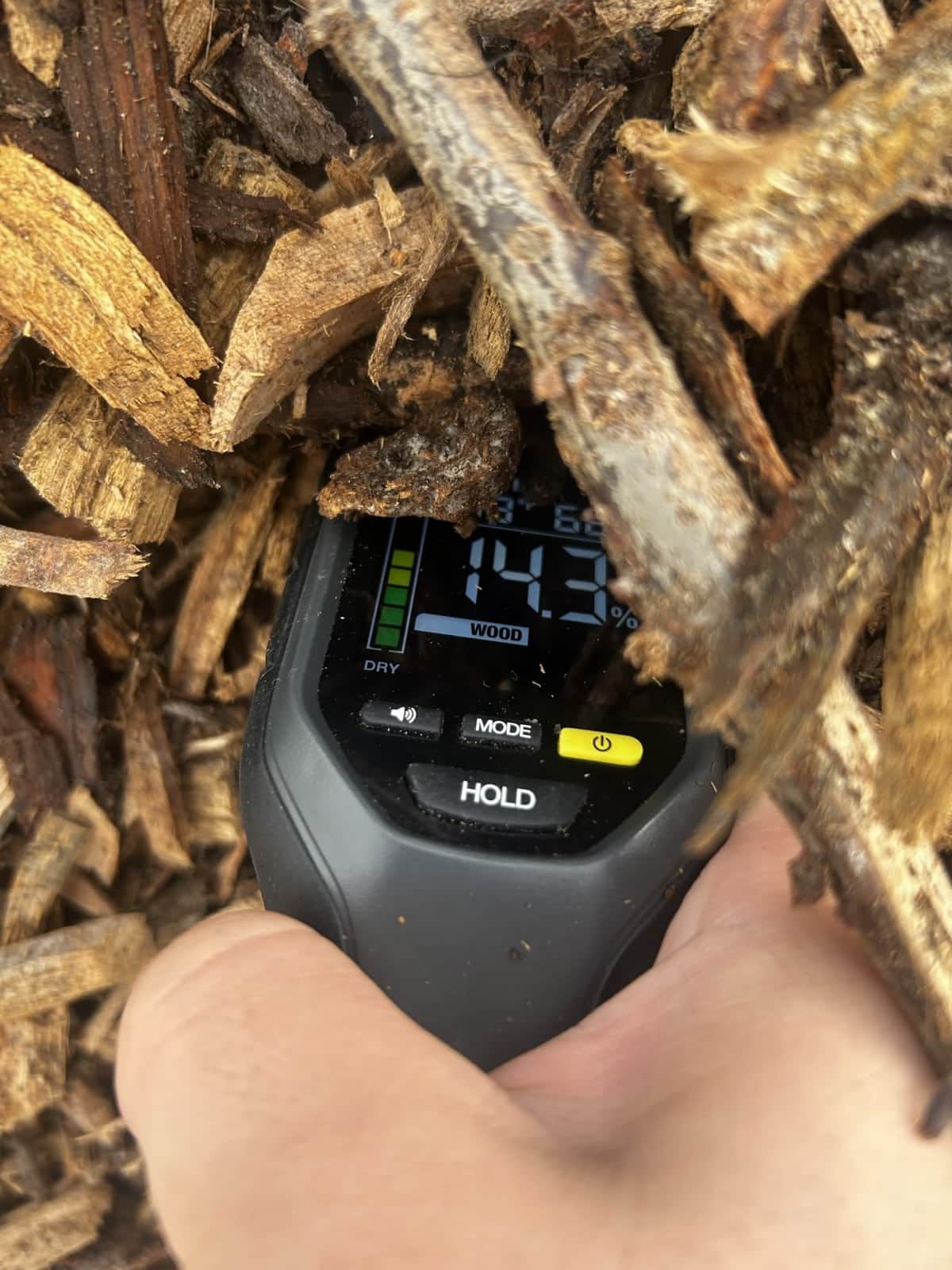 Moisture meter measuring wood chips
