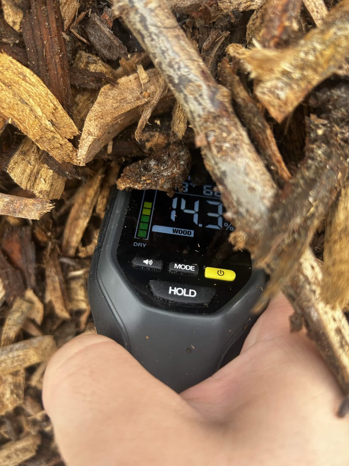 Moisture meter measuring wood chips